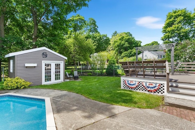 212 Broadway St, Wakefield, MA 01880 - view of yard featuring a deck, an outdoor structure, an outdoor pool, a pergola, and view of wooded area