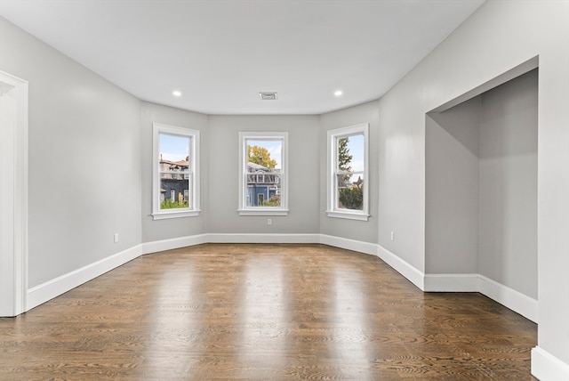 empty room featuring dark hardwood / wood-style floors