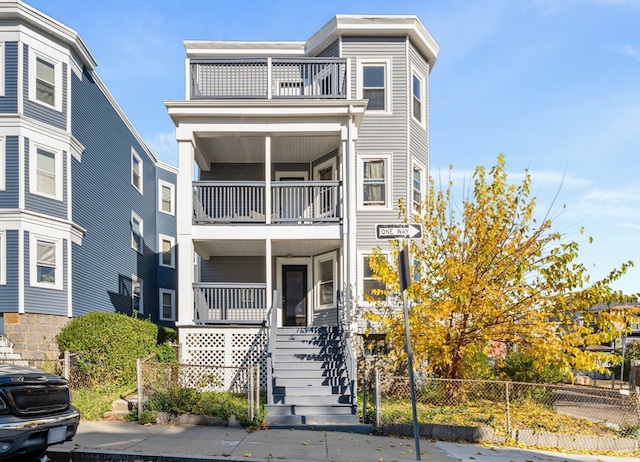 view of front facade featuring a balcony and a porch