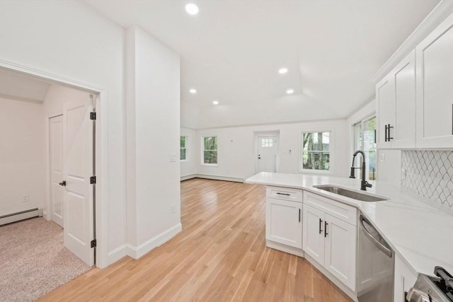 kitchen with recessed lighting, stainless steel dishwasher, a healthy amount of sunlight, and a sink