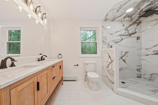 bathroom featuring toilet, baseboard heating, a sink, and a marble finish shower