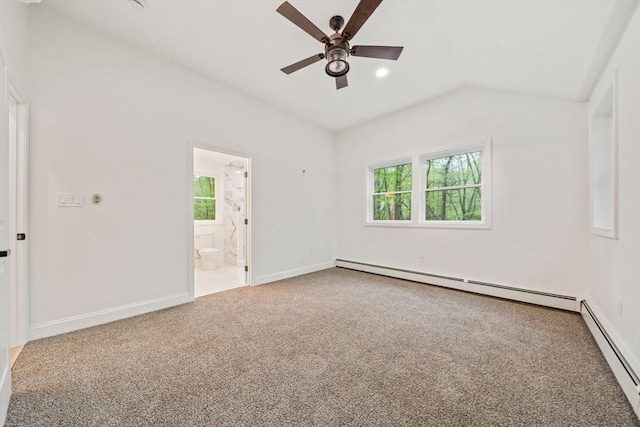 carpeted spare room with vaulted ceiling, baseboards, a ceiling fan, and a baseboard heating unit