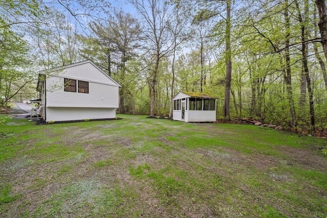 view of yard with a sunroom