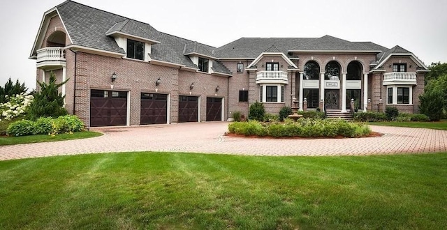 3 Regency Rdg, Andover, MA 01810 - french country inspired facade with driveway, a garage, a front yard, and brick siding