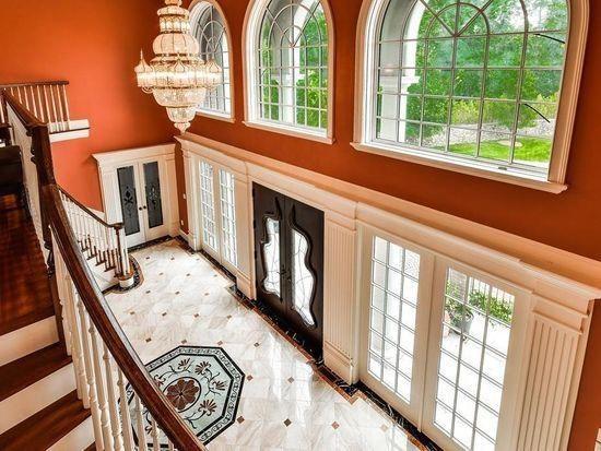 3 Regency Rdg, Andover, MA 01810 - entrance foyer featuring french doors, stairs, and a chandelier