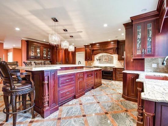 3 Regency Rdg, Andover, MA 01810 - bar with premium range hood, recessed lighting, crown molding, a chandelier, and inlaid floor details