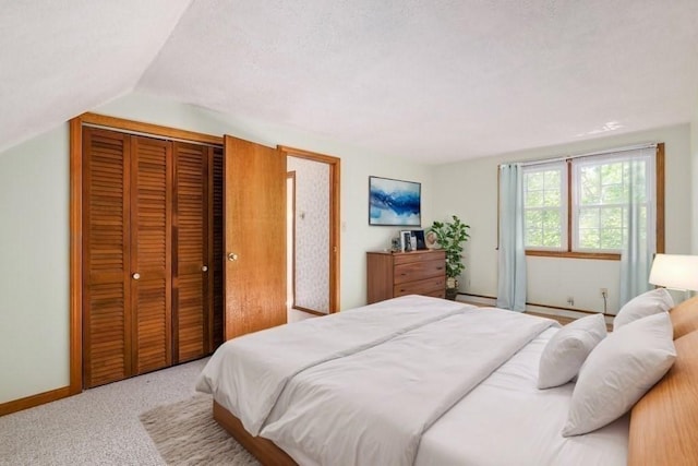 carpeted bedroom featuring vaulted ceiling