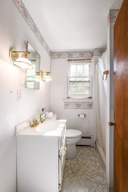 bathroom featuring vanity, curtained shower, toilet, and a baseboard heating unit