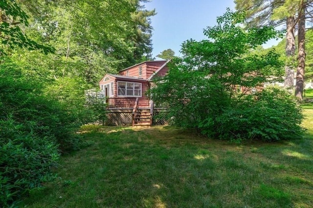 view of yard with a wooden deck