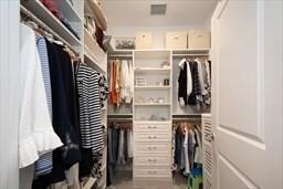 spacious closet featuring visible vents