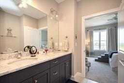 bathroom featuring double vanity and a sink