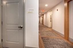 corridor with recessed lighting