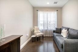 interior space with dark wood finished floors and baseboards