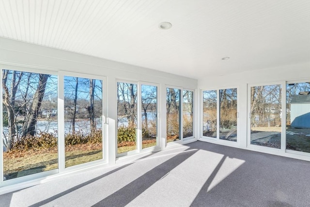 unfurnished sunroom with a wealth of natural light