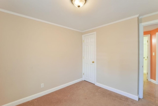 unfurnished room featuring light carpet and crown molding