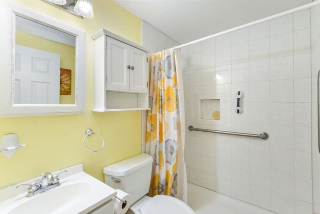 bathroom featuring vanity, a shower with shower curtain, and toilet