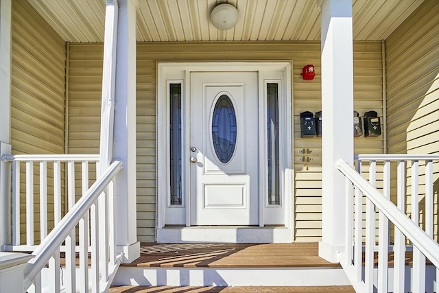 doorway to property featuring covered porch