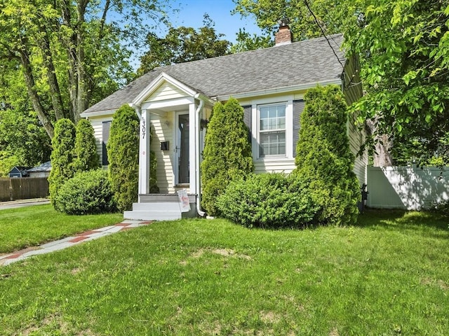 307 Boutelle St, Fitchburg, MA 01420 - view of front of house featuring a chimney and a shingled roof