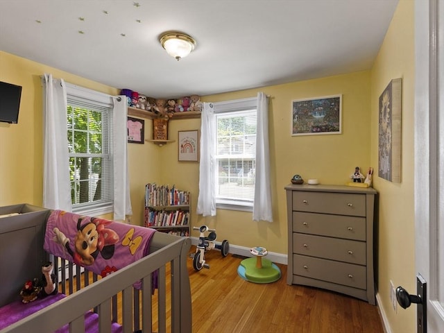 307 Boutelle St, Fitchburg, MA 01420 - bedroom featuring multiple windows and wood finished floors