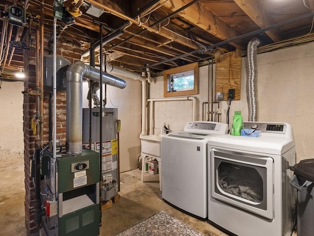 307 Boutelle St, Fitchburg, MA 01420 - laundry room featuring gas water heater and washing machine and clothes dryer