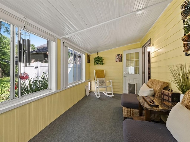 307 Boutelle St, Fitchburg, MA 01420 - sunroom / solarium featuring wooden walls, lofted ceiling, and carpet