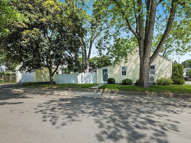 307 Boutelle St, Fitchburg, MA 01420 - view of property hidden behind natural elements featuring driveway and an outbuilding