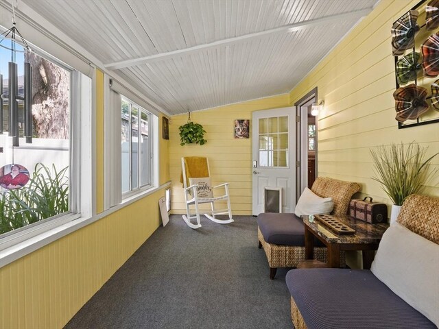 307 Boutelle St, Fitchburg, MA 01420 - sunroom with vaulted ceiling, wood walls, and carpet
