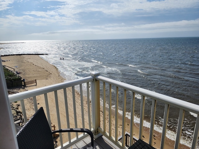 balcony with a beach view and a water view