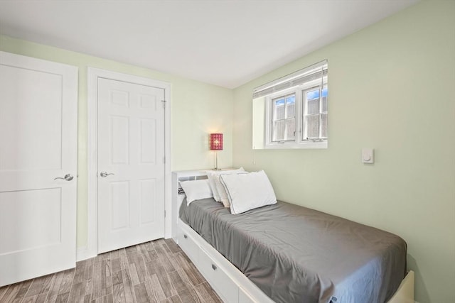 bedroom with wood finished floors
