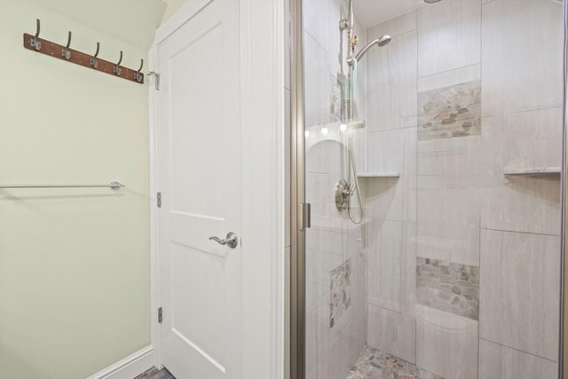 bathroom with a shower stall