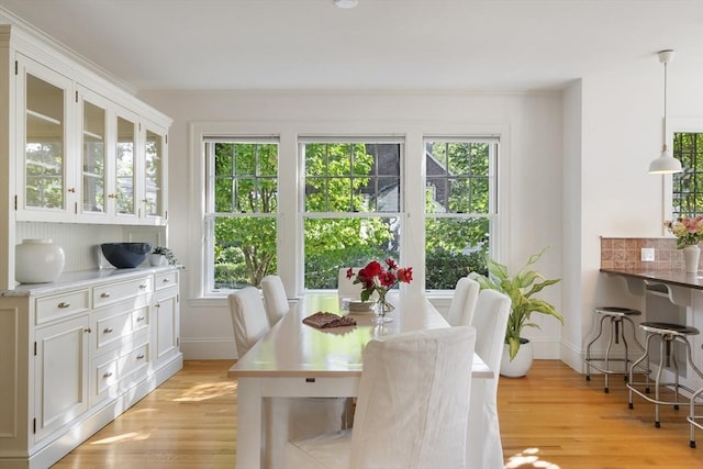 dining area featuring light wood-type flooring