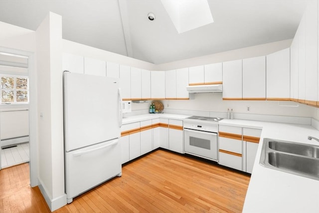 kitchen featuring under cabinet range hood, a baseboard heating unit, white appliances, a sink, and light countertops