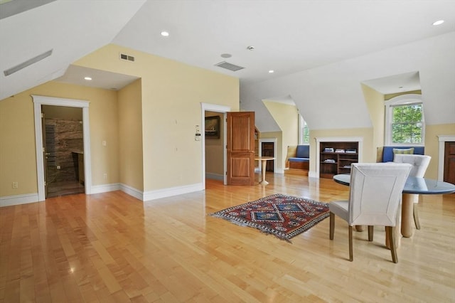 2 Azalea Way, Boxford, MA 01921 - dining area with a fireplace, light wood-style flooring, vaulted ceiling, and recessed lighting