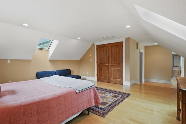 2 Azalea Way, Boxford, MA 01921 - bedroom with light wood finished floors, vaulted ceiling, a skylight, a closet, and recessed lighting