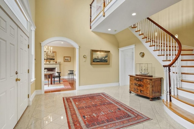 2 Azalea Way, Boxford, MA 01921 - entryway with a high ceiling, arched walkways, stairs, recessed lighting, and granite floors