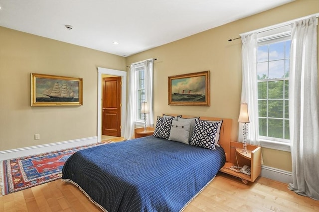 2 Azalea Way, Boxford, MA 01921 - bedroom with light wood-type flooring and multiple windows