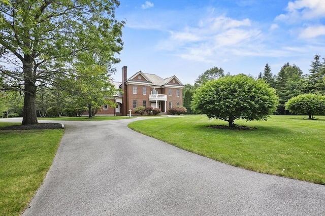 2 Azalea Way, Boxford, MA 01921 - colonial inspired home with a front lawn, a chimney, and driveway