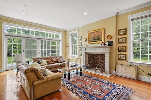 2 Azalea Way, Boxford, MA 01921 - living room featuring healthy amount of natural light, ornamental molding, a premium fireplace, wood finished floors, and recessed lighting