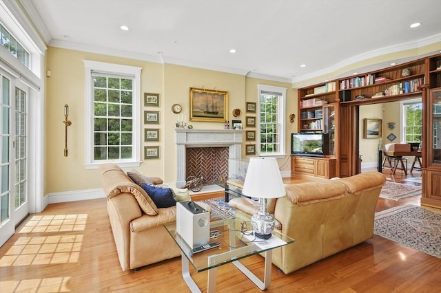 2 Azalea Way, Boxford, MA 01921 - living room with ornamental molding, light wood finished floors, a fireplace, and recessed lighting