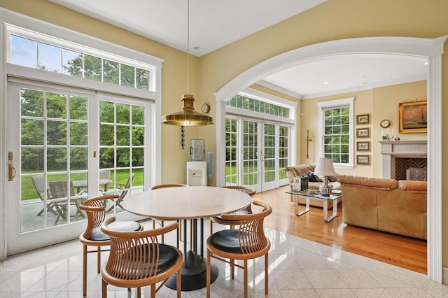 2 Azalea Way, Boxford, MA 01921 - dining room with arched walkways, crown molding, a fireplace, and granite floors
