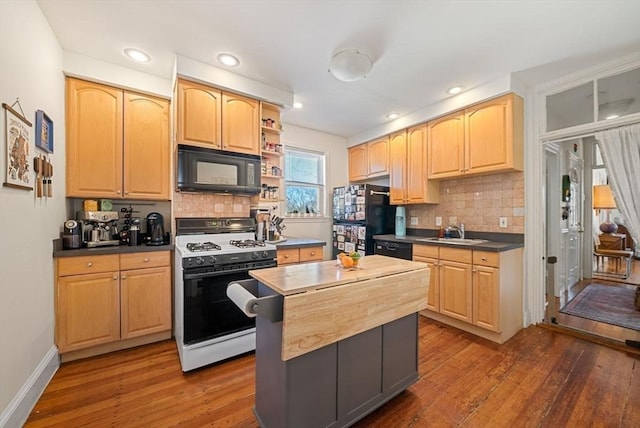 kitchen with wood-type flooring, black appliances, and light brown cabinetry