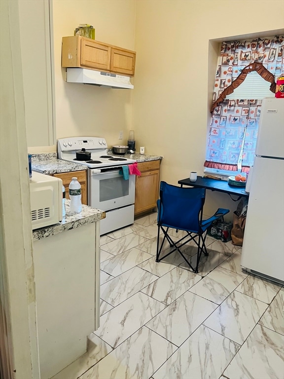 kitchen featuring white appliances