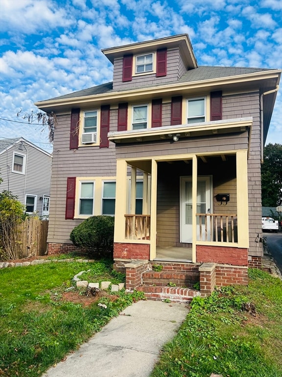 view of front of house featuring a porch and cooling unit