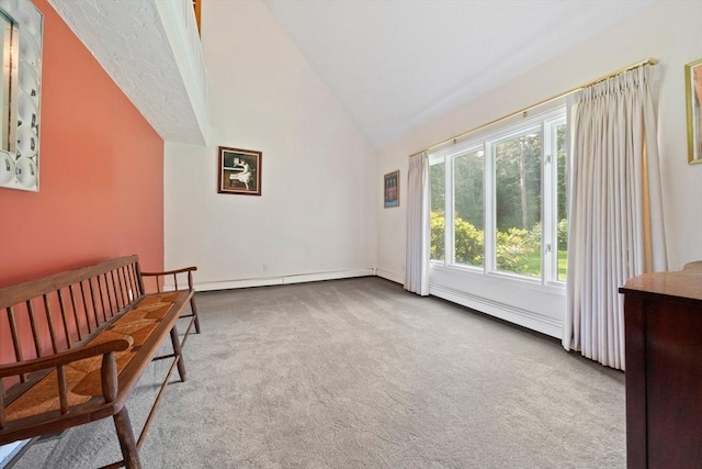 living area featuring carpet flooring, baseboard heating, and high vaulted ceiling