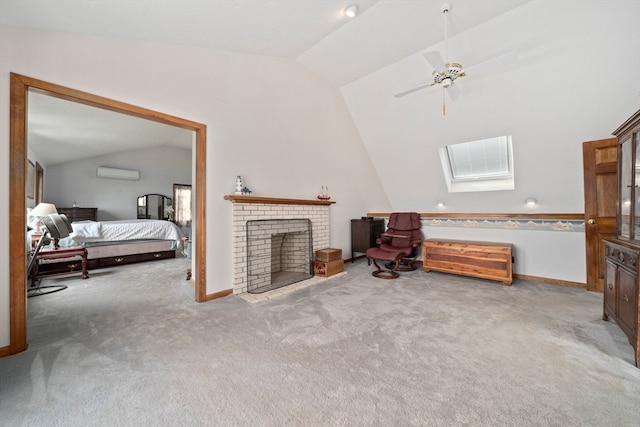 interior space with vaulted ceiling with skylight, a fireplace, ceiling fan, a wall mounted AC, and light carpet