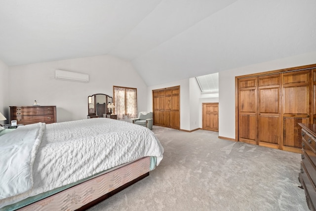 carpeted bedroom with vaulted ceiling and a wall mounted air conditioner