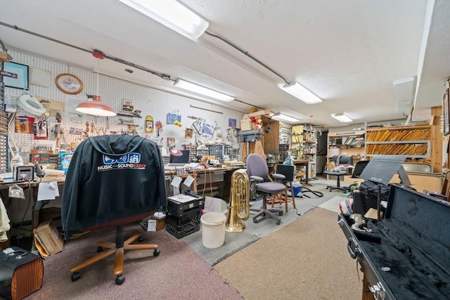 interior space featuring a workshop area and concrete floors