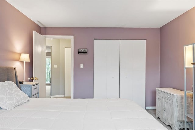 bedroom featuring a closet and baseboards