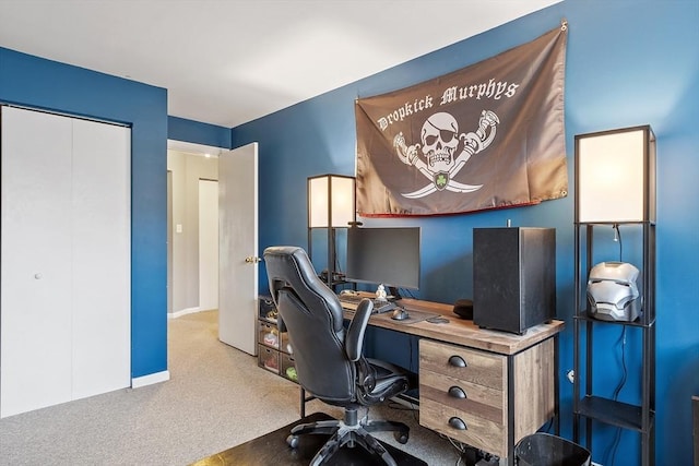 office space featuring baseboards and carpet flooring