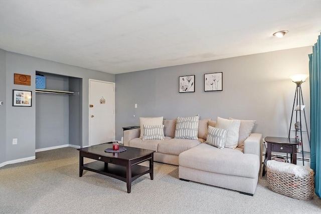 living room featuring baseboards and carpet floors